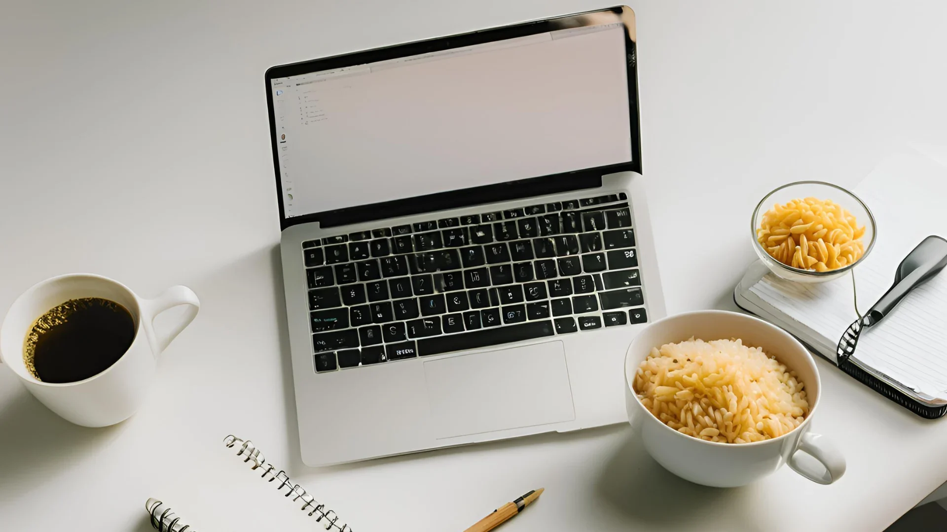 rica and pasta cups with coffee and laptop